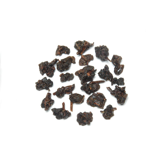 Dark charcoal roasted oolong tea made from amino acid-rich leaves, oxidized and roasted with longan wood for a deep, lasting flavor.