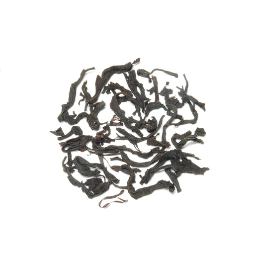 High-mountain black tea, fully oxidized and roasted with longan wood, featuring caramel and light floral aromas.